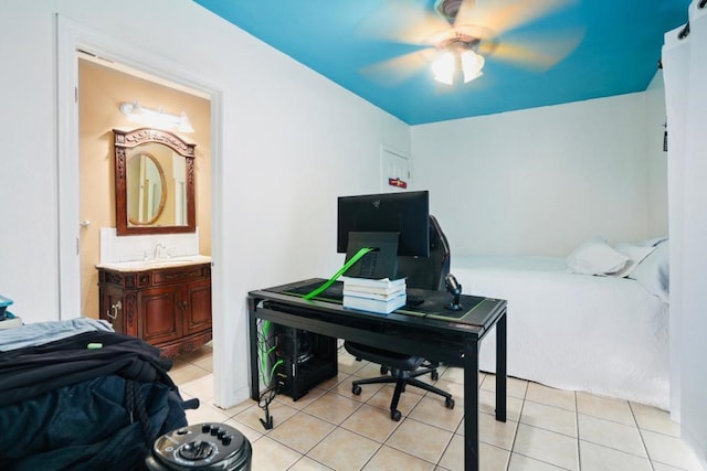 tiled home office with ceiling fan and sink