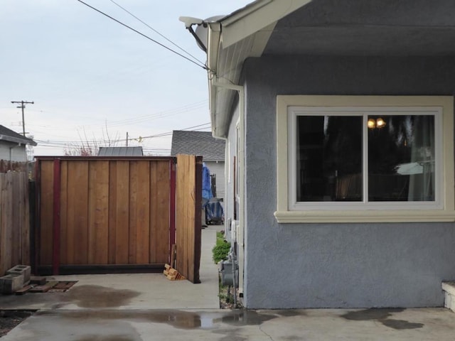 view of side of property featuring a patio area