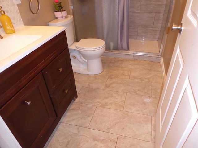 bathroom featuring curtained shower, toilet, and vanity