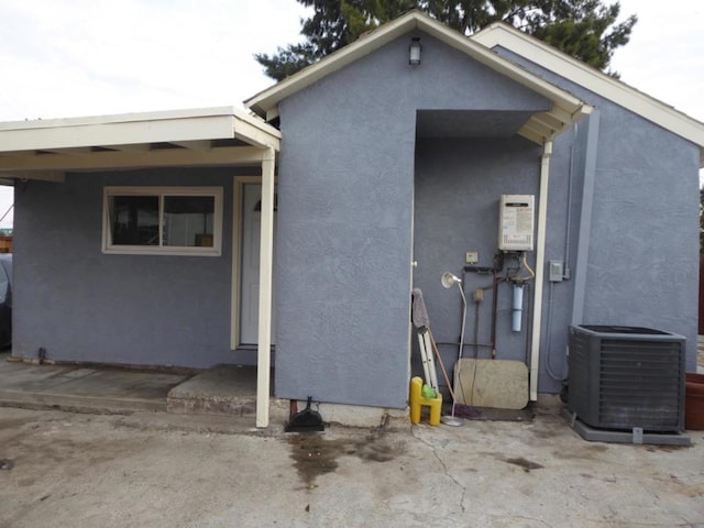 rear view of house with cooling unit