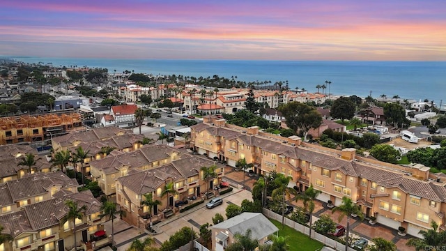 aerial view at dusk with a water view