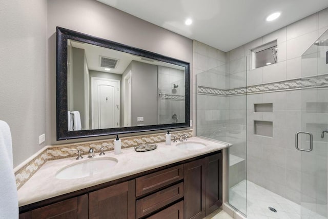 bathroom with vanity and walk in shower