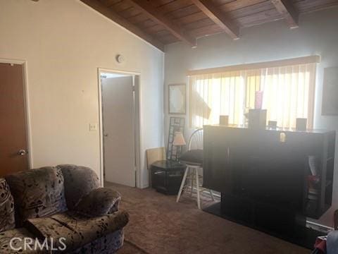 living room featuring lofted ceiling with beams, carpet flooring, and wooden ceiling