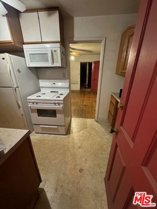 kitchen with ceiling fan and white appliances