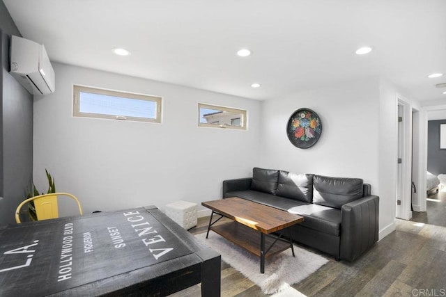 living room featuring dark hardwood / wood-style flooring and a wall mounted AC