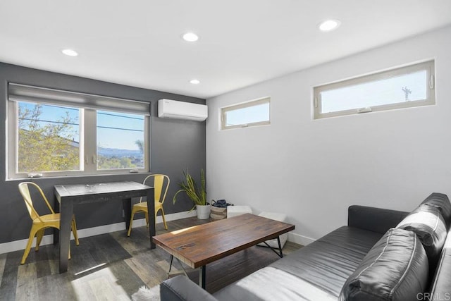 living room featuring an AC wall unit and dark hardwood / wood-style floors