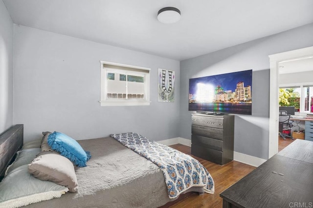 bedroom featuring dark hardwood / wood-style floors