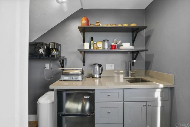 bar with sink, gray cabinets, and black appliances