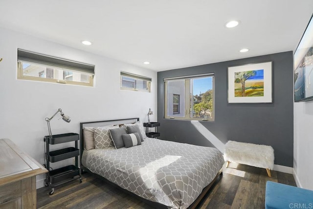 bedroom with dark wood-type flooring