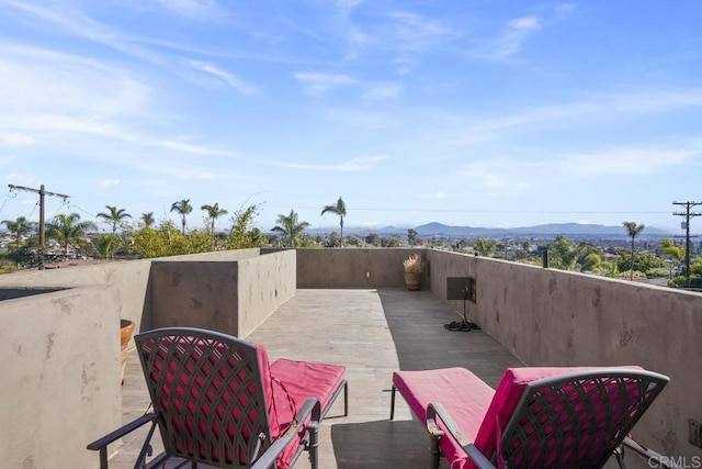 view of patio / terrace with a mountain view