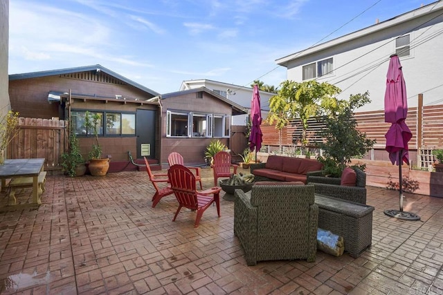 view of patio featuring fence and outdoor lounge area