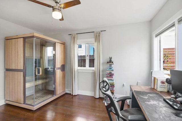 office space with ceiling fan, dark wood-style flooring, and baseboards