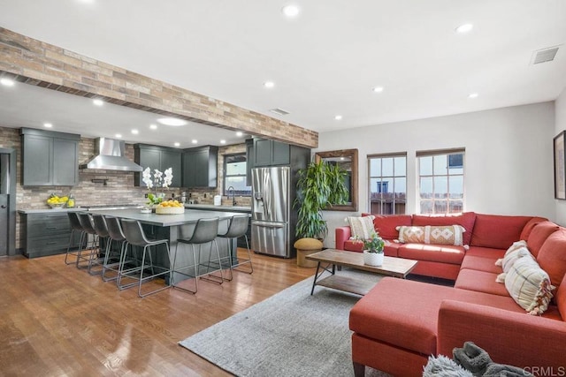 2211 Bancroft St, San Diego, CA 92104 - living area with healthy amount of natural light, light wood finished floors, and recessed lighting