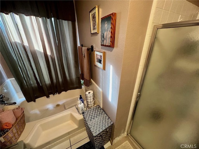 bathroom with a shower with door