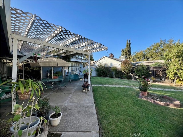 view of yard with a pergola and a patio