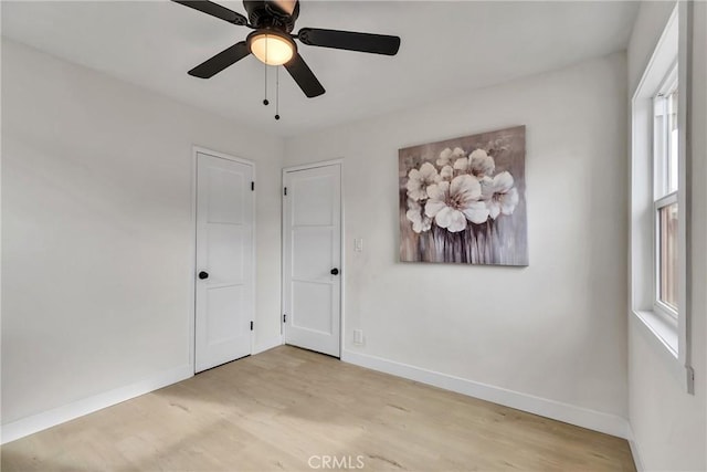 unfurnished room featuring ceiling fan and light hardwood / wood-style flooring