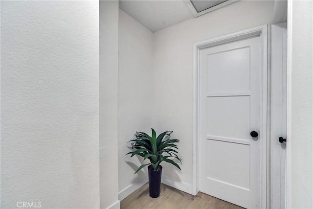 corridor with light wood-type flooring