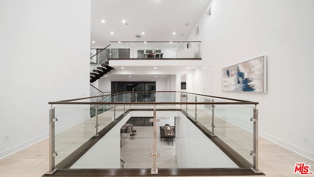 staircase with a high ceiling