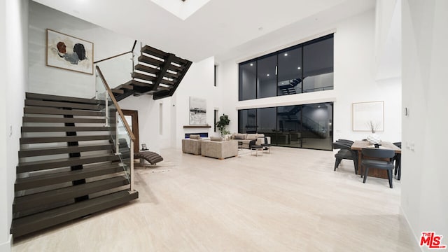 living room with a high ceiling