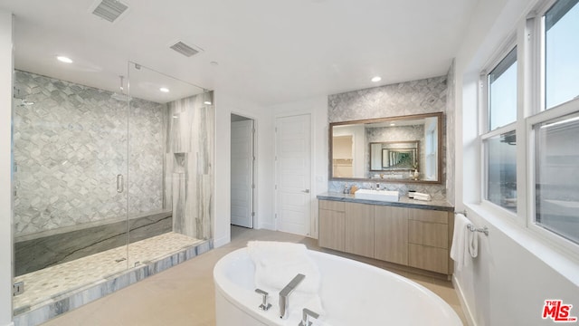 bathroom with plus walk in shower and vanity