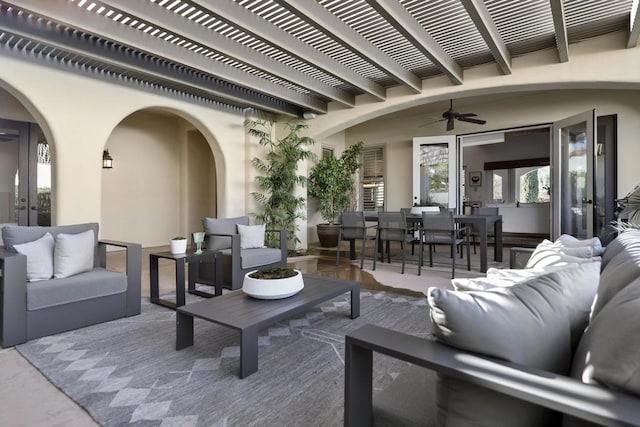 view of patio featuring a pergola, outdoor lounge area, and ceiling fan