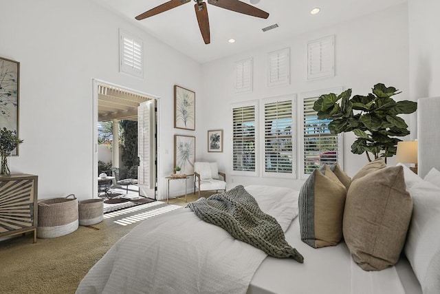 bedroom with ceiling fan, access to exterior, and carpet