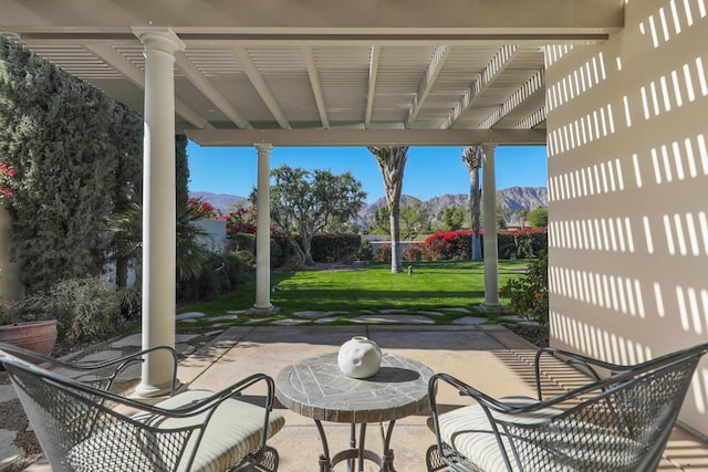 view of patio / terrace featuring a mountain view