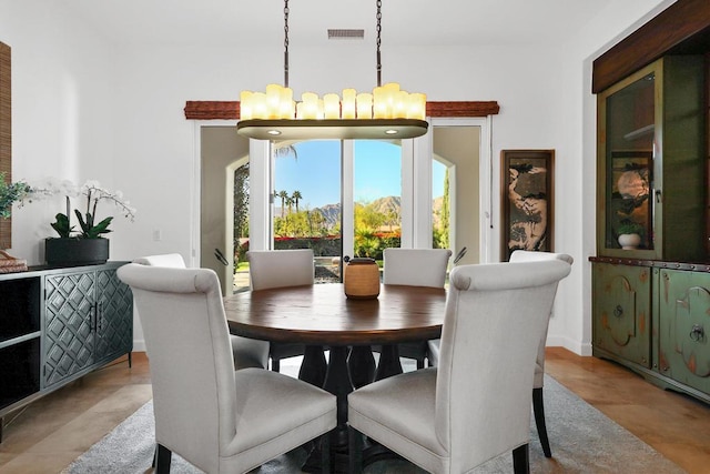 dining space featuring a chandelier