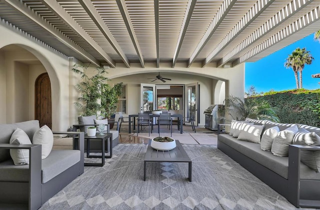 view of patio with ceiling fan, an outdoor living space, area for grilling, and a pergola