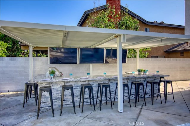 view of patio with a bar