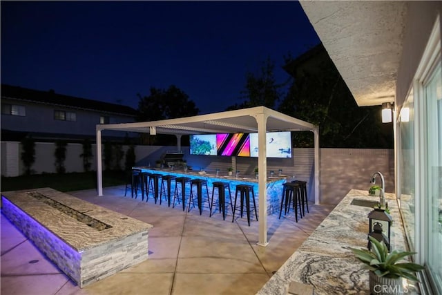 view of patio / terrace featuring an outdoor wet bar