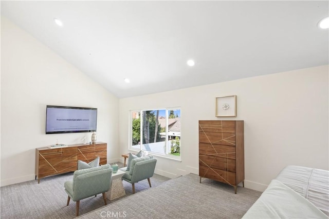 bedroom featuring light carpet and high vaulted ceiling