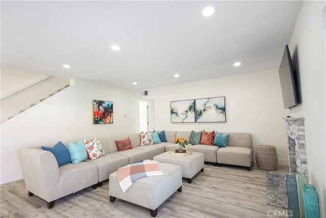 living room with light hardwood / wood-style floors