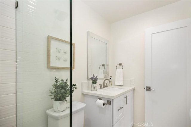 bathroom featuring toilet and vanity