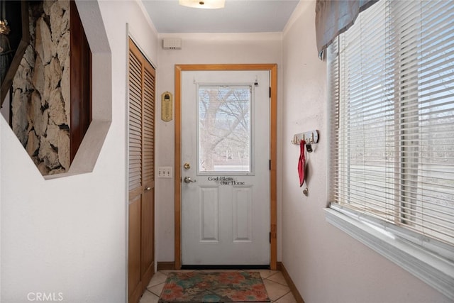 entryway featuring light tile patterned floors