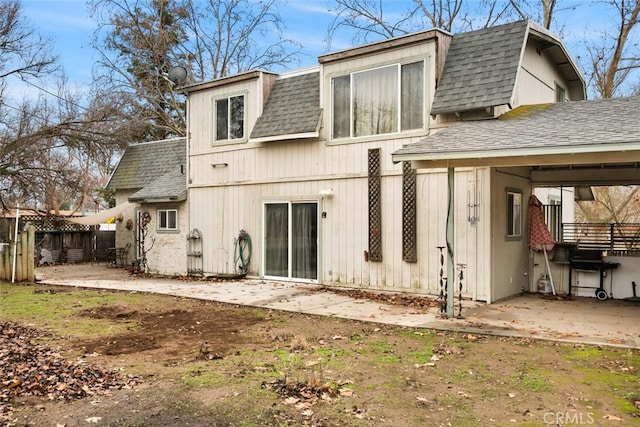 rear view of house featuring a patio area