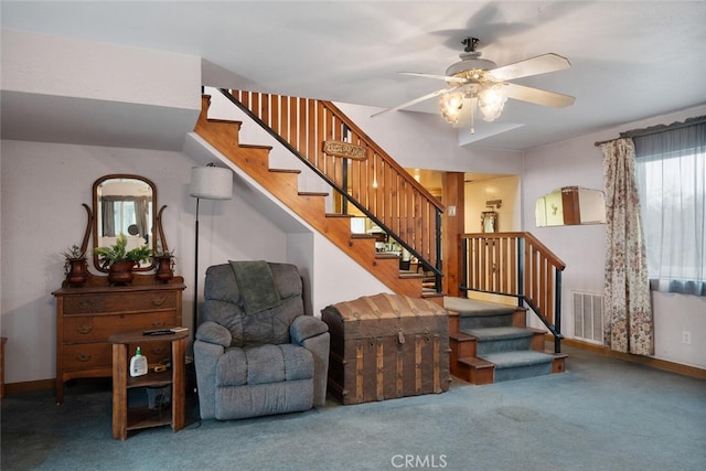 stairs featuring carpet and ceiling fan