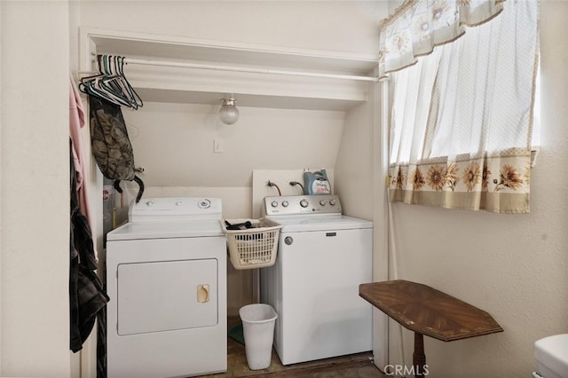 laundry room featuring washing machine and clothes dryer