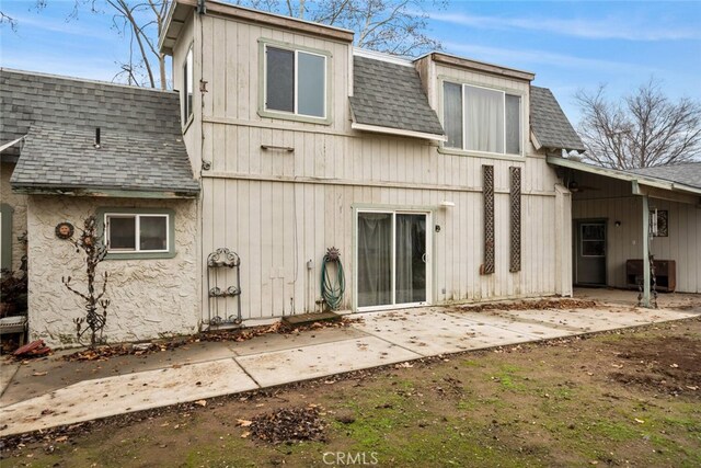 back of property with a patio area