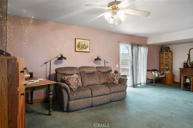 living room with ceiling fan and carpet flooring