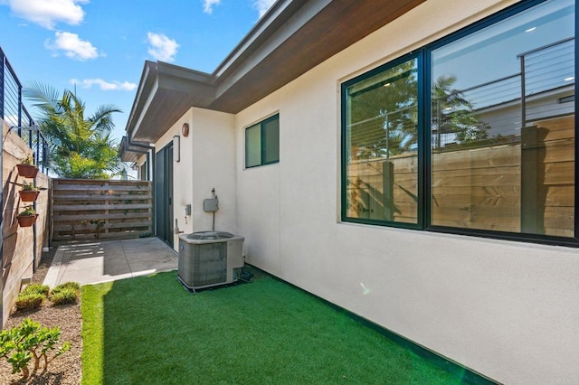 view of yard with a patio area and central AC unit