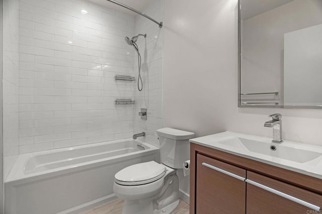 full bathroom with toilet, tile patterned flooring, tiled shower / bath, and vanity