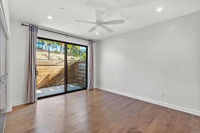 unfurnished room featuring ceiling fan and wood-type flooring