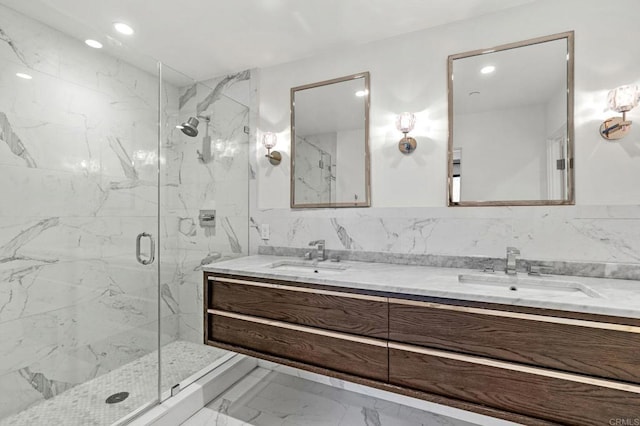 bathroom with vanity and a shower with door