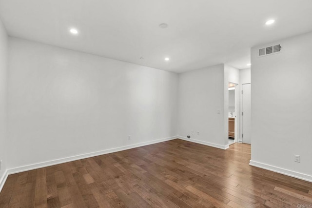 empty room with hardwood / wood-style flooring