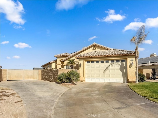 mediterranean / spanish-style home featuring a garage