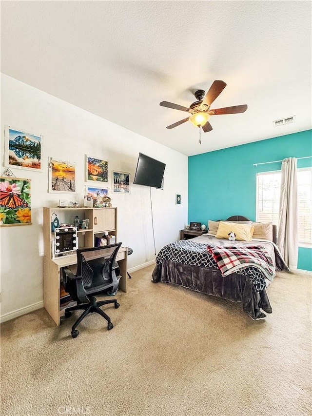 carpeted bedroom with ceiling fan