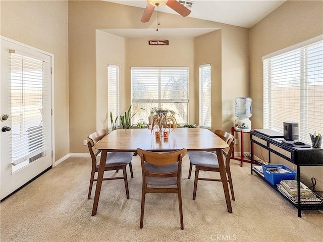 carpeted dining area featuring ceiling fan and a wealth of natural light