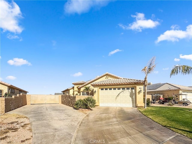 view of front of home with a garage and a front yard