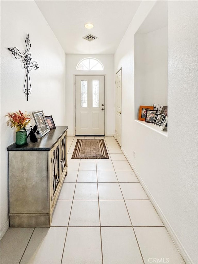 entryway featuring light tile patterned floors